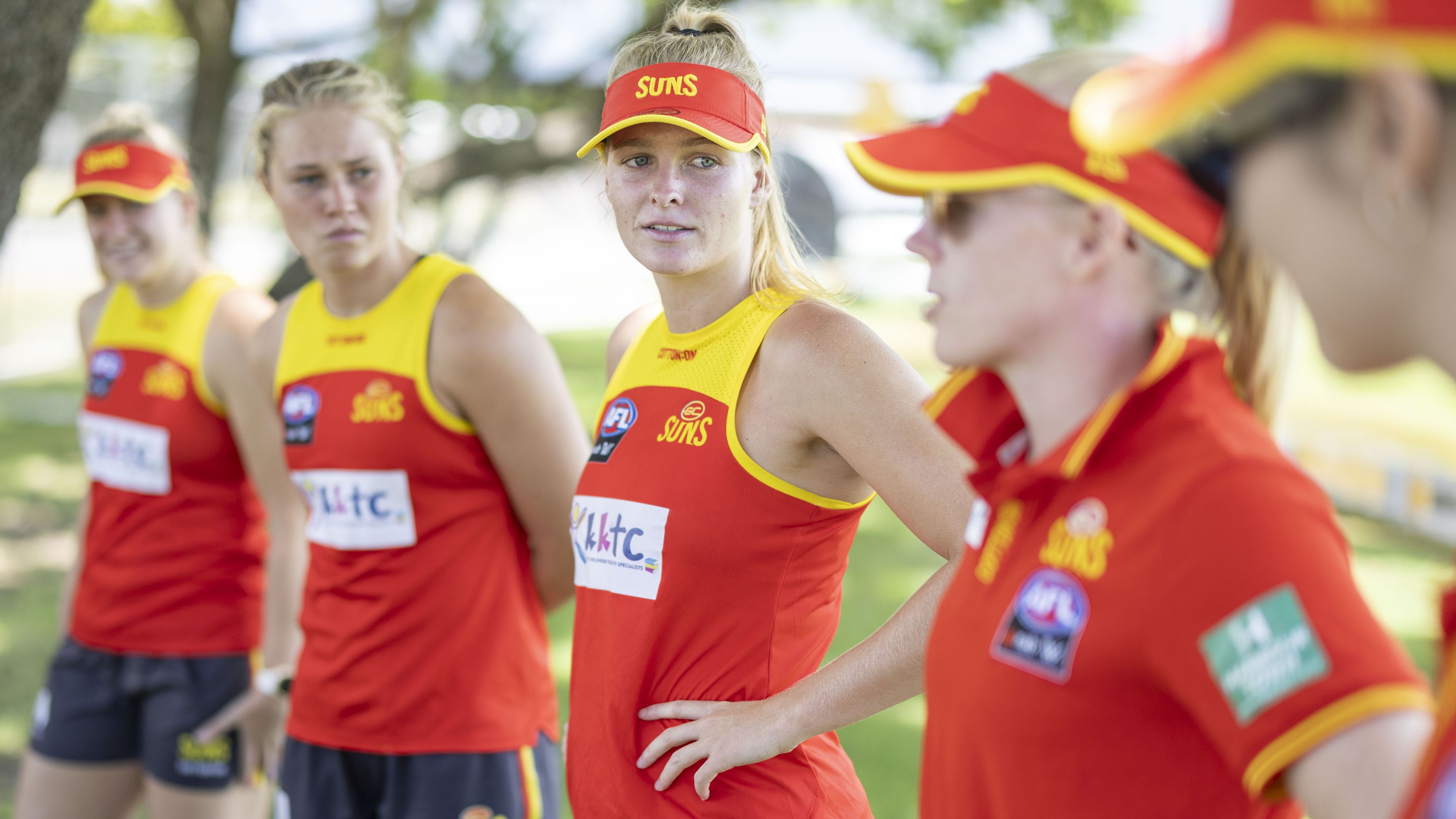 Suns players looks on during a combined AFL Queensland / Gold Coast Suns football clinic.