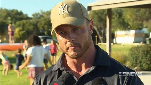 Policeman Lenny Carlier said he grabbed a snorkel from his car to help the boy breathe and then instructed onlookers to dig from the back of the beach towards the hole and water so that it wouldn't collapse further. Picture: 9NEWS.