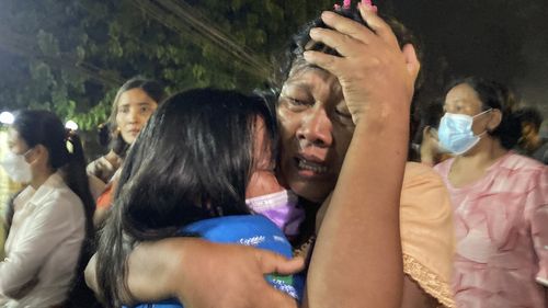 A mother reacts after her daughter, left, was released from Insein Prison in Yangon, Myanmar. 