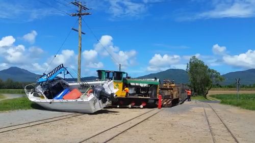 Cane train derails after hitting boat on Cairns tracks