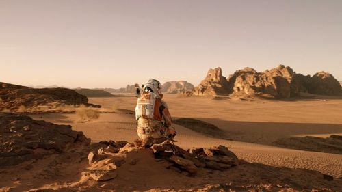 Matt Damon sits on the planet Mars in the movie 'The Martian'.