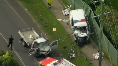 Three police officers have been injured after a patrol car was torn apart in a serious car crash in Queensland's south-east.