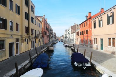 VENICE, ITALY - MARCH 9: A canal and the roads next to it are seen completely empty on March 9, 2020 in Venice, Italy. Prime Minister Giuseppe Conte announced a "national emergency" due to the coronavirus outbreak and imposed quarantines on the Lombardy and Veneto regions, which contain roughly a quarter of the country's population. Italy has the highest number of cases and fatalities in Europe.  The movements in and out are allowed only for work reasons, health reasons proven by a medical certi