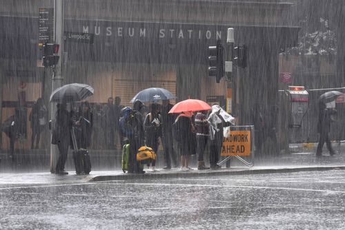 The umbrellas were out in force today in Sydney's CBD as the deluge hit. Picture: AAP