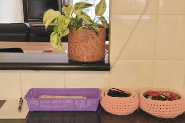 A simple basket helps organise receipts on the kitchen bench entryway.