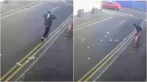 CCTV captured the moment the cash began trailing behind the robber. (Greater Manchester Police)