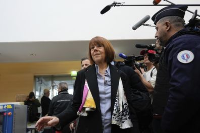 Gisele Pelicot, who was allegedly drugged by her now former husband so that he and others could assault her, arrives at the court house in Avignon, southern France, Thursday, Dec. 19, 2024. (AP Photo/Lewis Joly)