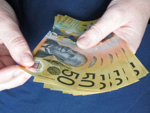 close up person holding cash