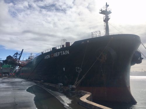 Iron Chieftan was unloading iron ore in the early hours of this morning when a conveyor belt caught alight. Picture: Supplied.