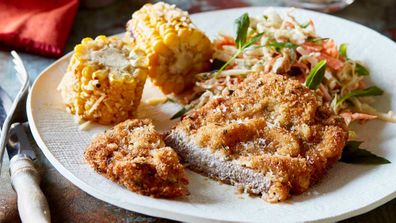 Rosemary beef schnitzel with coleslaw and corn recipe