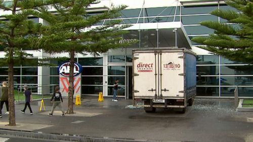 The truck smashed into the sign at AFL House this morning.