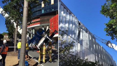A crane has fallen across Grey Street in South Brisbane, and into a Queensland College of Art building. (Twitter / @QASMedDirector)