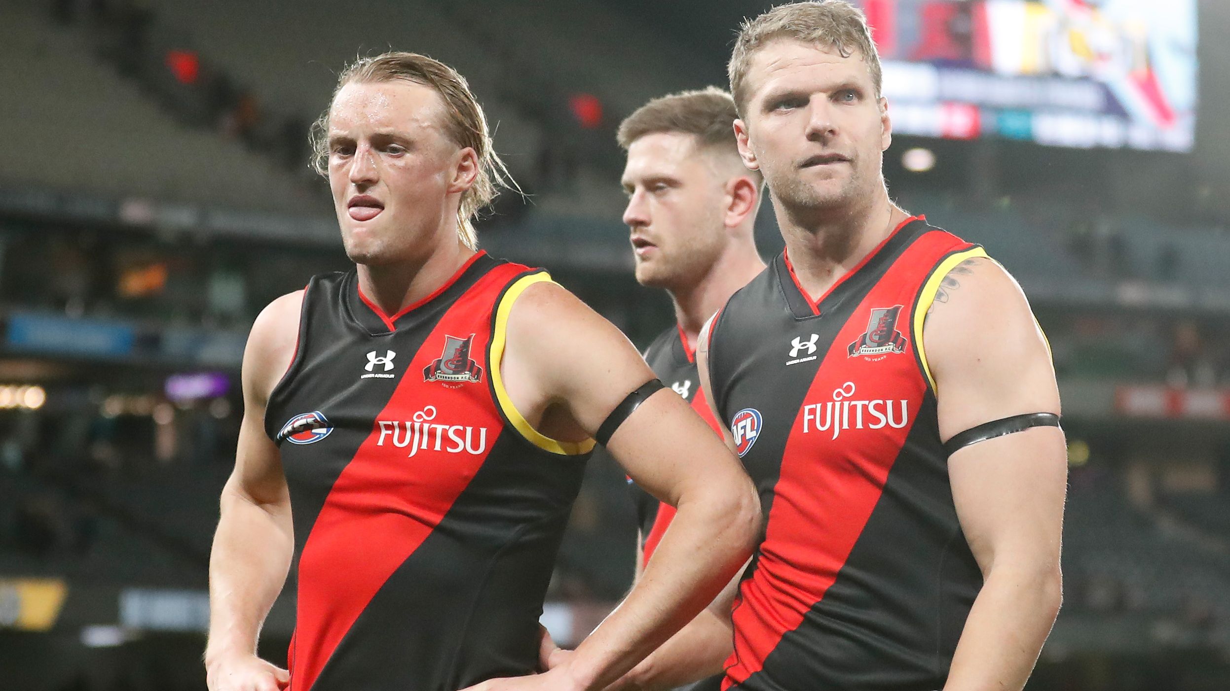 Mason Redman and Jake Stringer of the Bombers look dejected after a loss.