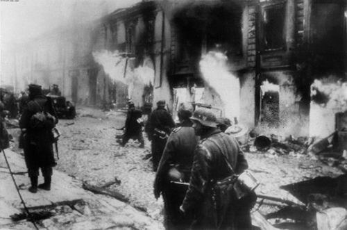 In this photo passed by Nazi censors and obtained by The Associated Press via neutral Swedish photo agency Pressens Bild, caption by the Nazis says it shows German soldiers penetrating one of Zhytomyr's streets in the Ukraine after recapture by the Nazis in the counter-offensive in the Kiev Bulge, Dec. 20, 1943.  (Nazi Government/Buro Laux/Pressens Bild via AP)