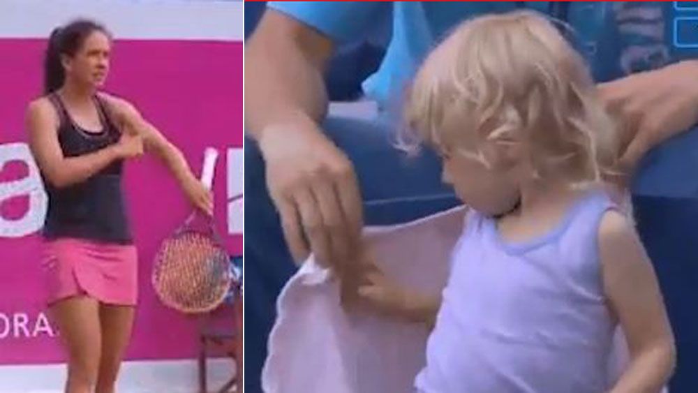 Swiss tennis player Patty Schnyder stops mid-match to make sure he daughter is taken care of