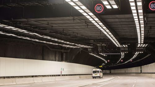 WestConnex workers carrying out final preparations ahead of the opening of the new M5/M8 tunnels to traffic in July.