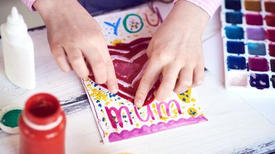 Girl making mother's day card
