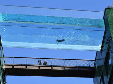 The transparent 25-metre-long outdoor pool, known as the Sky Pool, will allow residents to swim from one building to the other, 10 stories above the ground.