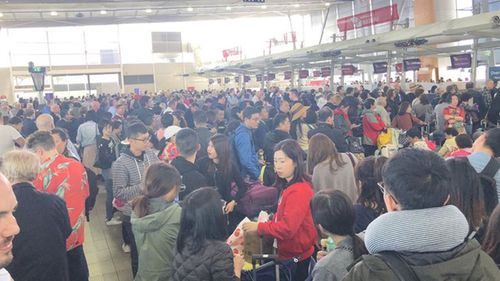 Sydney Airport is working to clear the last of a backlog from yesterday caused by wild winds that saw flights cancelled and delayed and passengers stranded.