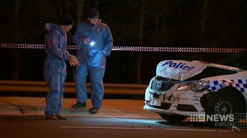 The police car was badly damaged in the collision. (9NEWS)