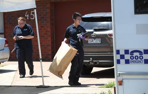Detectives take away bags of evidence. (AAP)