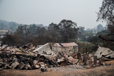 Bushfires swept through Cobargo on New Years Eve 2019 killing two, and destroying several homes and businesses. (AAP Image/James Gourley) 