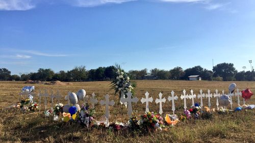 A white cross for each victim has been placed in a field on the outskirts of the town. (Lizzie Pearl)