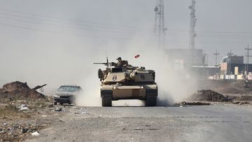 An Iraqi army tank drives through Gogjali as it heads to Mosul, on November 4, 2016, during a military operation to retake the main hub city from ISIS. (AFP)