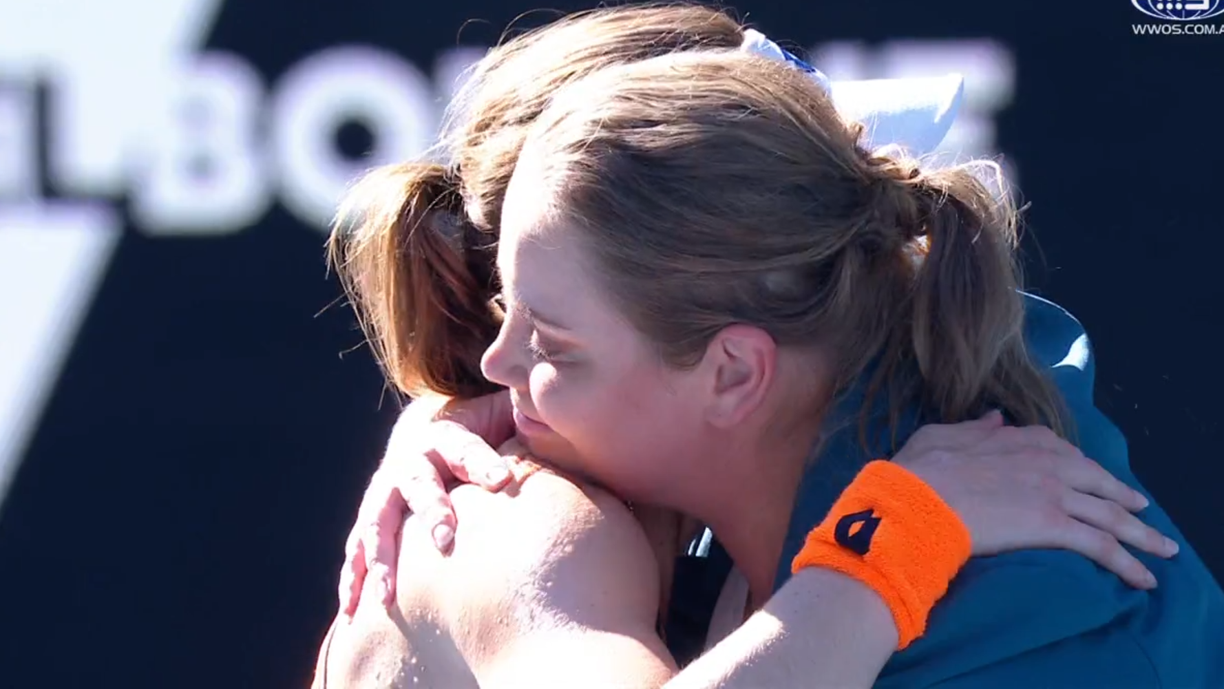 Jelena Dokic and Alize Cornet embrace on the court.