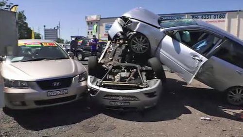 The car ploughed into a number of parked cars in the motor vehicle dealership.