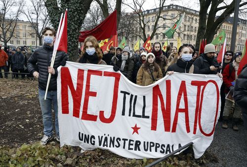 People take part in a demonstration against Turkish President Recep Tayyip Erdogan and Sweden's NATO bid arranged by The Kurdish Democratic Society Center in Sweden, in Stockholm, Saturday, Jan. 21. 2023. Sign reads in Swedish "No to NATO". Turkey has blocked Sweden and Finlands bids to join NATO, which needs approval by all member states, saying Sweden in particular needs to crack down on Kurdish and other groups that Ankara considers as terrorists. (Christine Olsson/TT via AP)