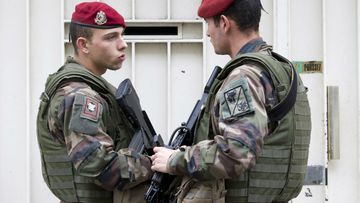 Soldiers stand guard outside a synagogue in Paris. (AAP)