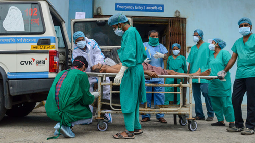 A critical patient who tested positive is being taken to an ICU unit at a COVID-19 care hospital in Kolkata , India.