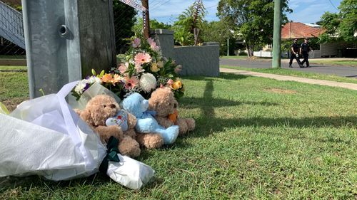 Flowers and tributes for the family left at the scene.