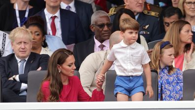 (L) Prime Minister Boris Johnson, Catherine, Duchess of Cambridge holds hands with Prince Louis of Cambridge during the Platinum Pageant on June 05, 2022 in London, England.  