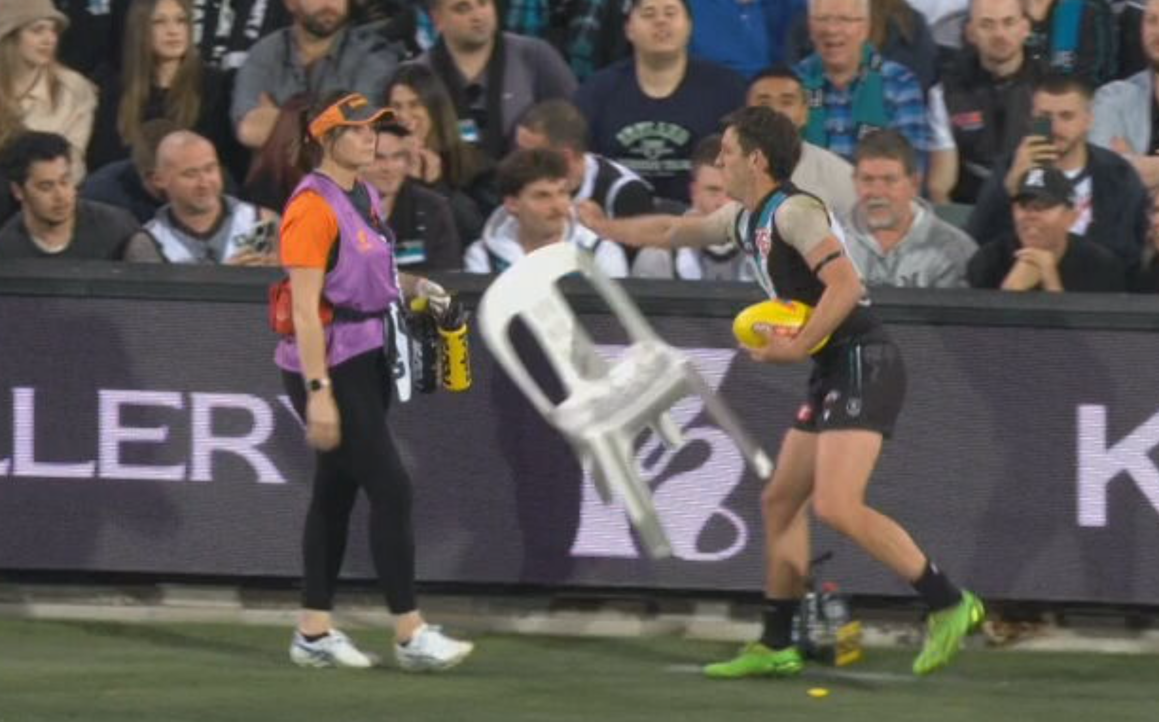 Zak Butters throws chair in frustration with GWS Giants trainer during Port Adelaide's loss