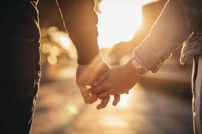 Young couple holding hands