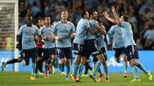 Fans swamp pitch after Sydney FC win local derby