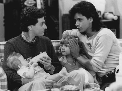 Full House "Wait Until Dark!?"Ñ Living in "Mr. Rogers" house is no picnic for single swinger Jesse on "Full House." (Pictured L to R: Bob Saget as Danny, Jodie Sweetin as Stephanie and John Stamos as Jesse.) June 20, 1990.  (Photo by Lorimar Television).