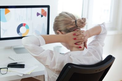 Tired businesswoman at office