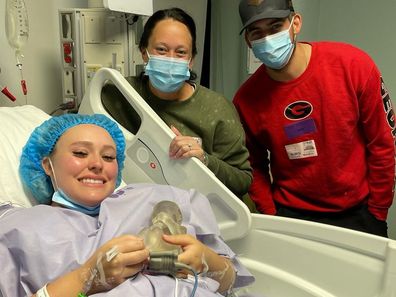 Jaiden Ashlea with her mum and fiancé post surgery. 