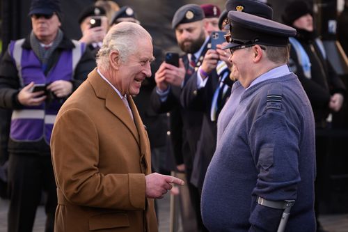 King Charles III speaks with veterans as he visits Luton Town Hall on December 6, 2022 in Luton, England 