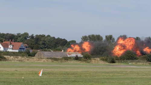 Flames erupt from the scene of the crash. (AAP)