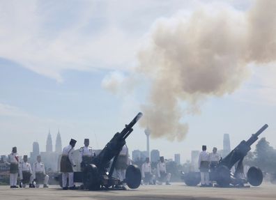 Army soldiers fire cannons during a welcoming ceremony of the 17th King of Malaysia, Sultan Ibrahim Iskandar at National Palace in Kuala Lumpur, Malaysia Wednesday, Jan. 31, 2024.  