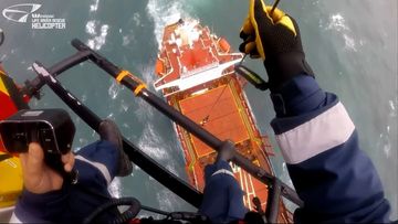 A person is winched to the ship stranded off the NSW coast.
