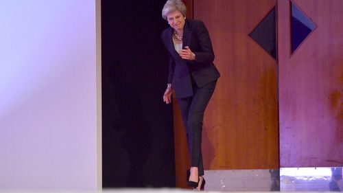 The first signs of the dance as Theresa May walks on stage.