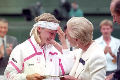 The Duchess of Kent comforts Jana Novotna as she presents her with the runner up trophy on centre court at Wimbledon.