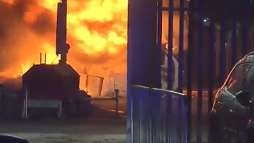 The helicopter burst into flames after crashing into a car park.