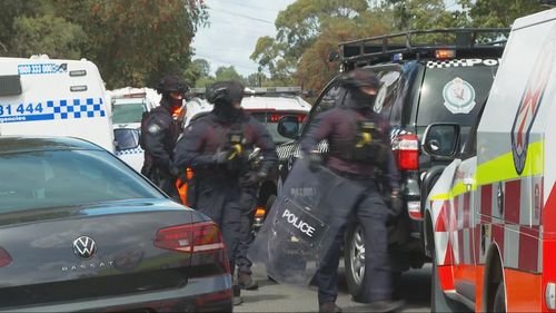 Police have stormed a unit and arrested a man after an hour of negotiations following a stabbing in western Sydney.