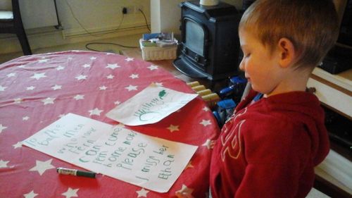 Ethan Ferrier with his letter and drawing. (Facebook)